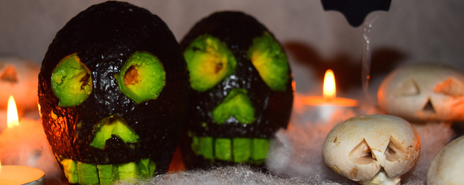Fun, easy and spooky halloween food art ideas for kids from MyNutriCounter - Avocado skulls and mushroom ghosts